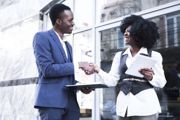 african-young-businessman-businesswoman-shaking-hands_23-2148190681